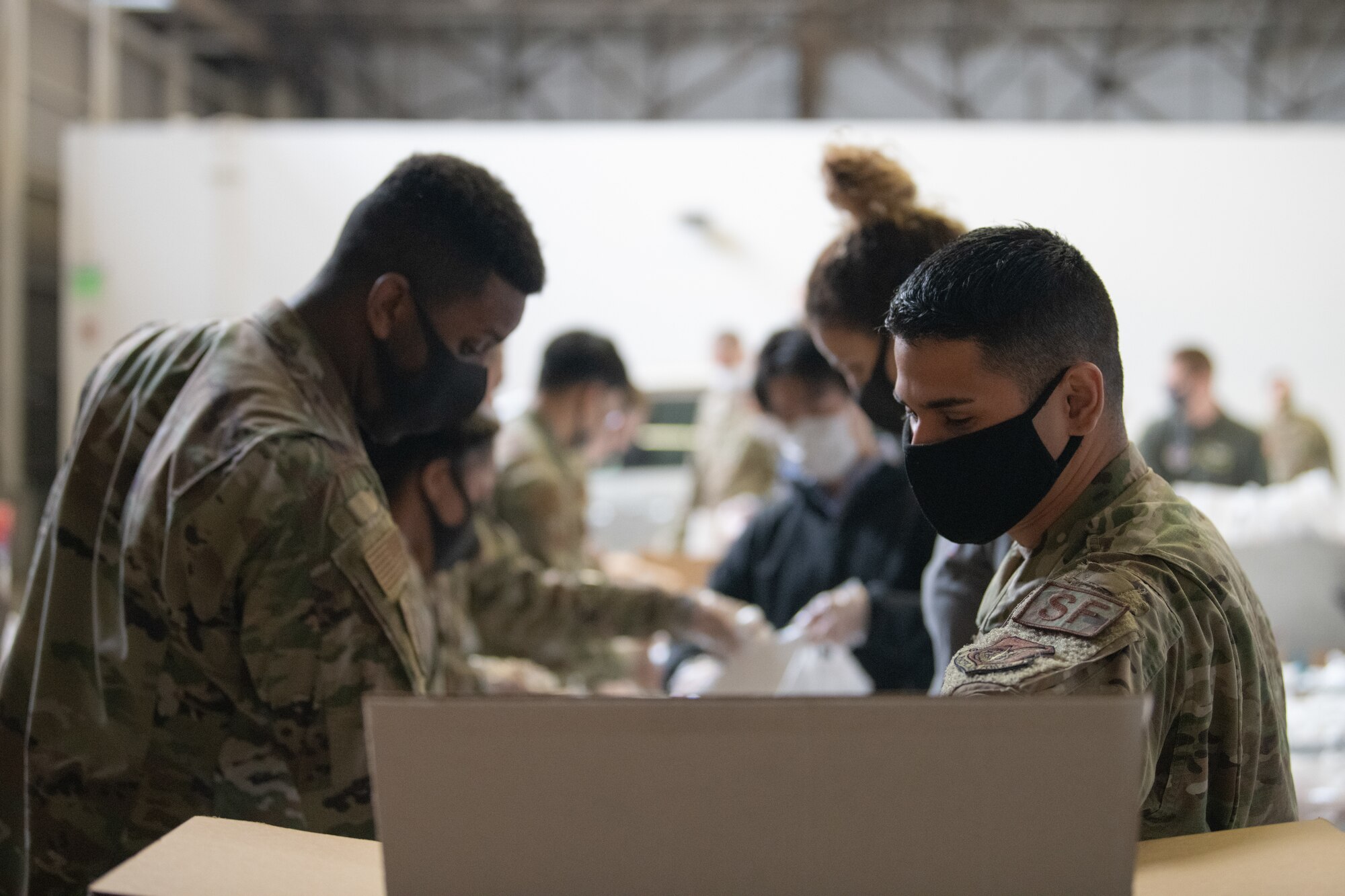 Airman and Volunteers Build Care Kits