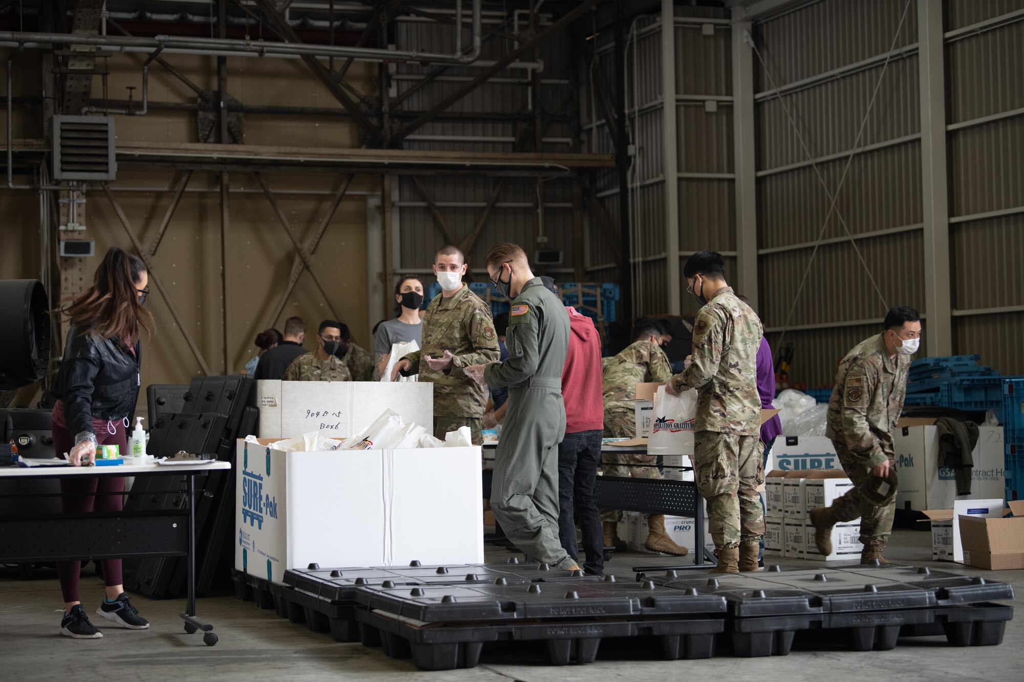 Airman and Volunteers Build Care Kits