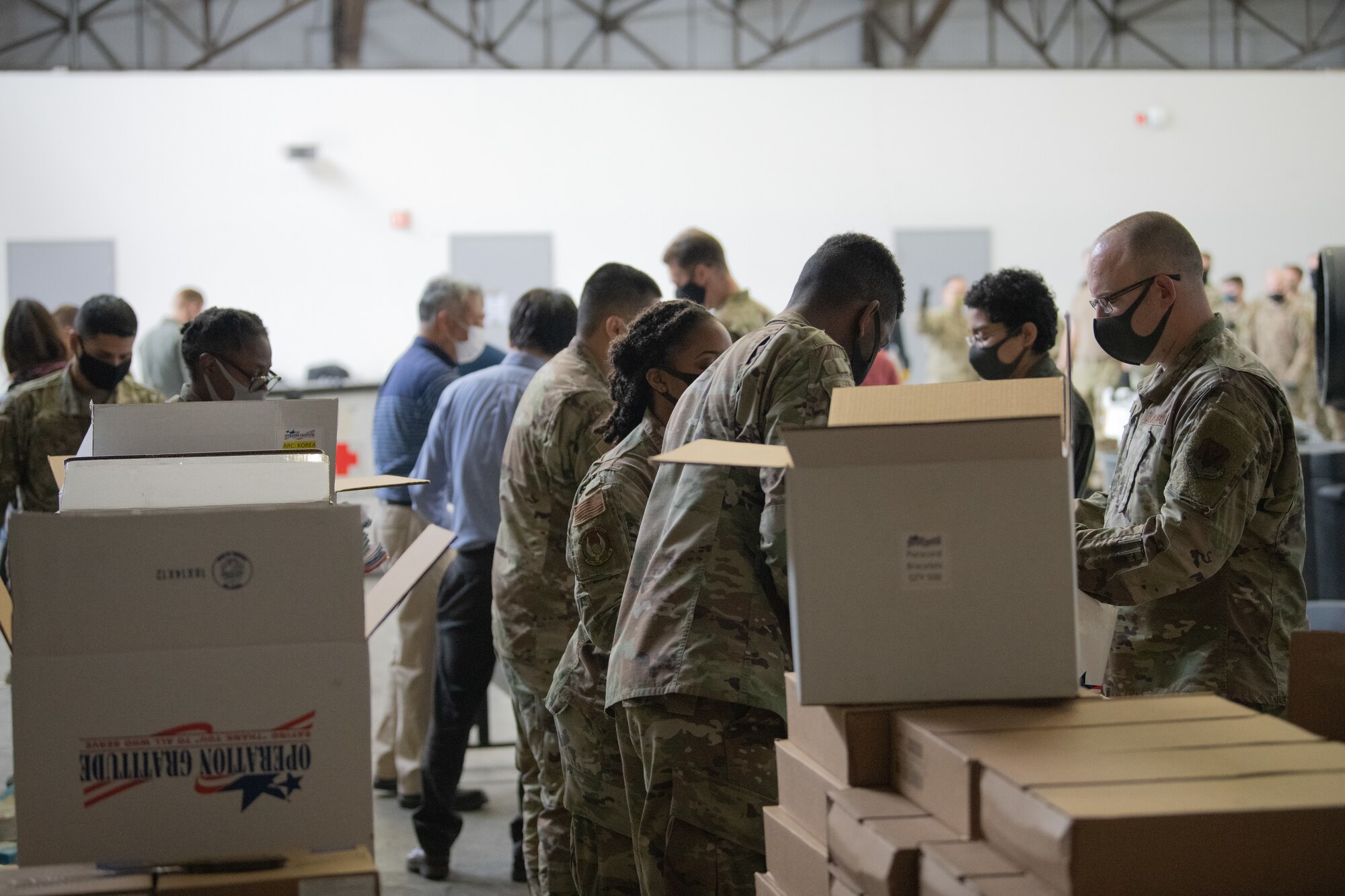 Airman and Volunteers Build Care Kits