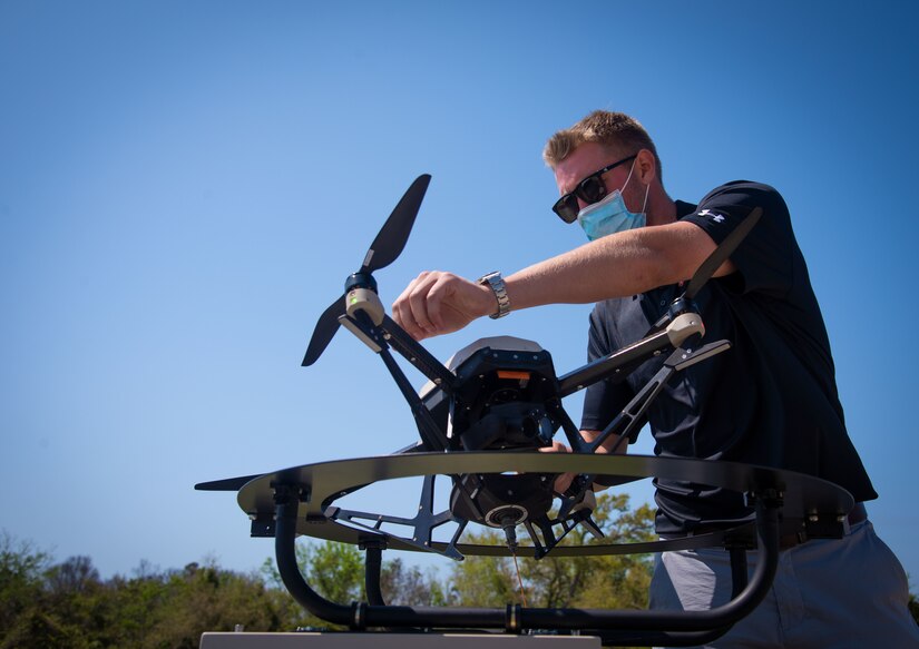 A man handles a drone.