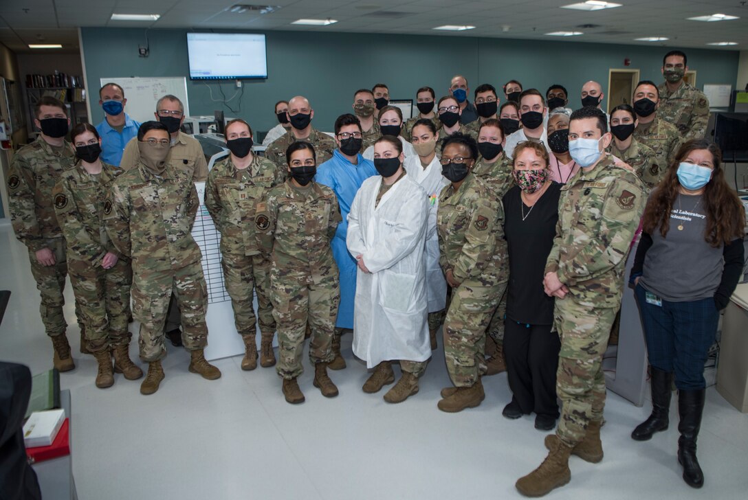 Medical personnel from the 673d Medical Support Squadron pose for a photo during National Medical Laboratory Professionals Week (NMLPW) at Joint Base Elmendorf-Richardson, Alaska, 19 April, 2021. National Medical Laboratory Professionals Week, April 18 to 24, is a time to celebrate more than 280,000 medical laboratory professionals across the nation who perform and interpret laboratory tests that save lives and keep people healthy.