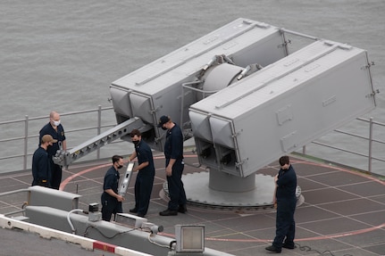 Sailors assigned to the aircraft carrier USS Gerald R. Ford (CVN 78) combat systems department load an Evolved Sea Sparrow Missile (ESSM) during an ammunition onload.