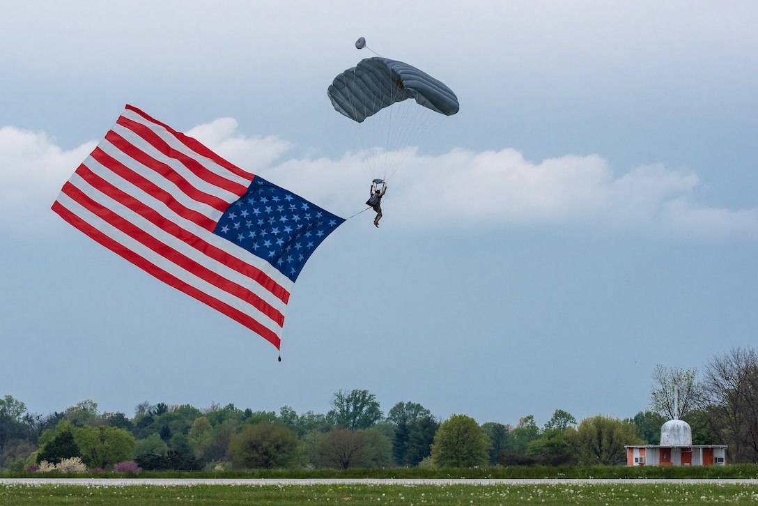 A member of the Kentucky Air National Guard’s 123rd Special Tactics Squadron executes a high-altitude, low-opening parachute jump into Bowman Field in Louisville, Ky., April 17, 2021 to open the Thunder Over Louisville air show. The annual event featured more than 20 military and civilian aircraft. (U.S. Air National Guard photo by Dale Greer)