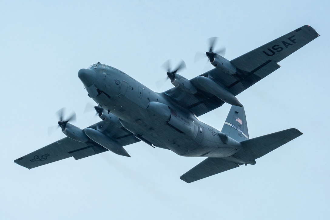 A Kentucky Air National Guard C-130 Hercules from the 123rd Airlift Wing performs an aerial demonstration over Bowman Field in Louisville, Ky., April 17, 2021, as part of a three-ship formation during the Thunder Over Louisville air show. The annual event featured more than 20 military and civilian air craft this year. (U.S. Air National Guard photo by Dale Greer)