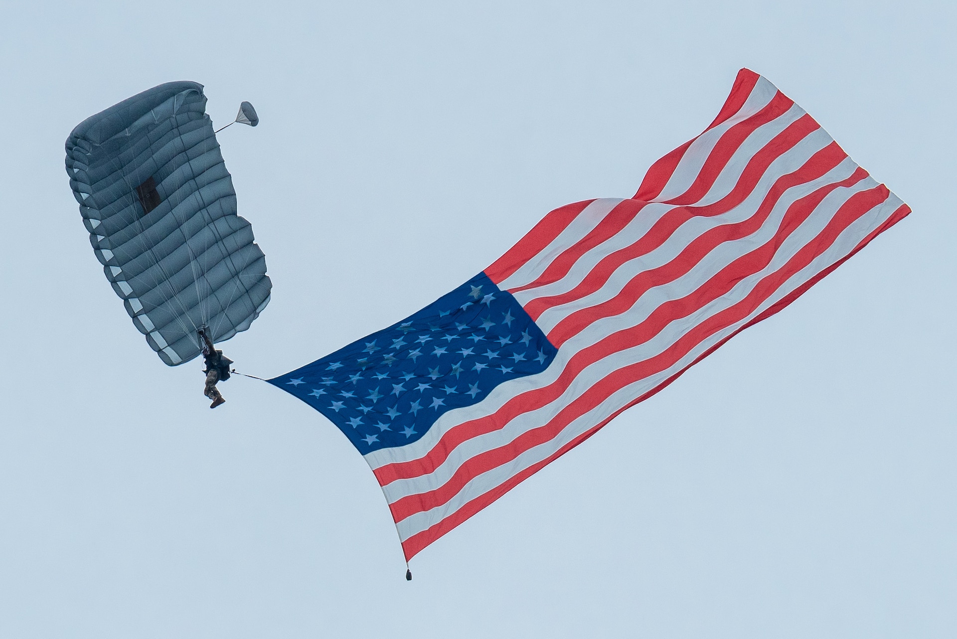 A member of the Kentucky Air National Guard’s 123rd Special Tactics Squadron executes a high-altitude, low-opening parachute jump into Bowman Field in Louisville, Ky., April 17, 2021 to open the Thunder Over Louisville air show. The annual event featured more than 20 military and civilian aircraft. (U.S. Air National Guard photo by Dale Greer)