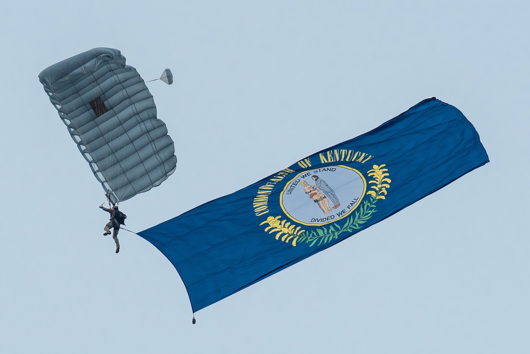 A member of the Kentucky Air National Guard’s 123rd Special Tactics Squadron executes a high-altitude, low-opening parachute jump into Bowman Field in Louisville, Ky., April 17, 2021 to open the Thunder Over Louisville air show. The annual event featured more than 20 military and civilian aircraft. (U.S. Air National Guard photo by Dale Greer)