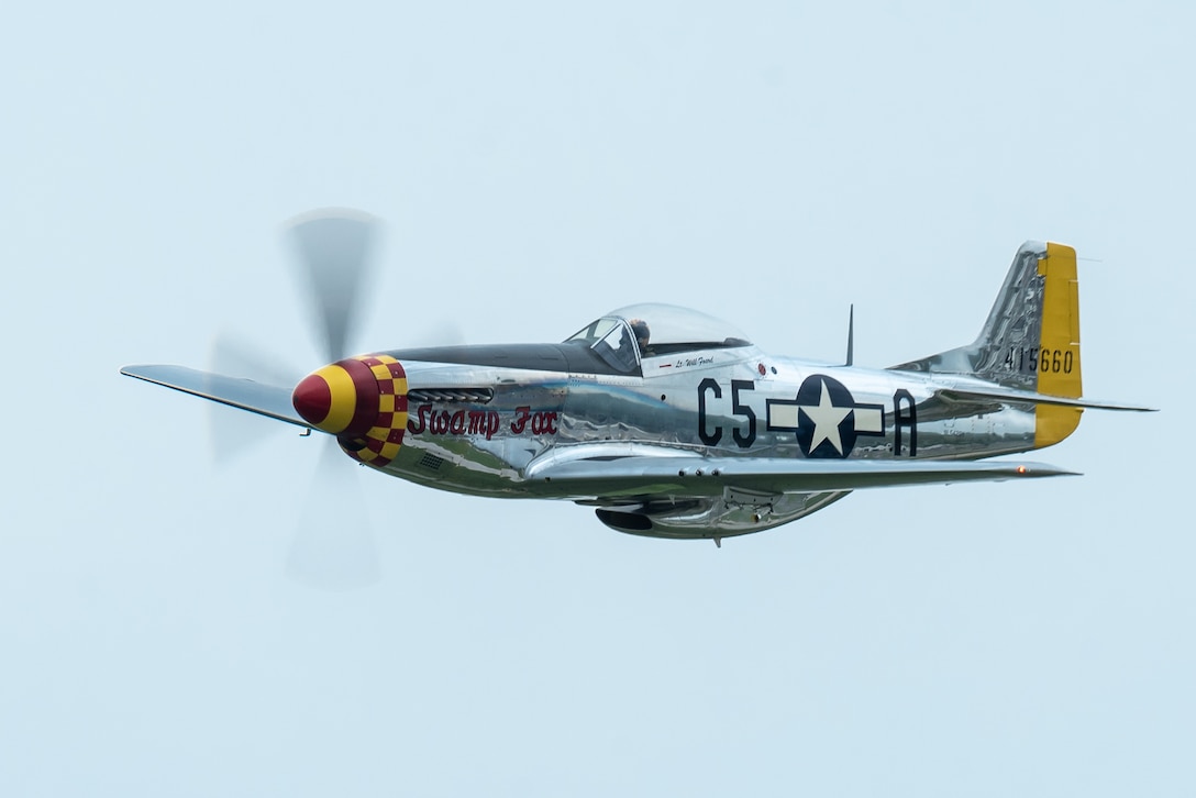 A P-51 Mustang performs an aerial demonstration over Bowman Field in Louisville, Ky., April 17, 2021, as part of the Thunder Over Louisville air show. The aircraft, nicknamed Swamp Fox, is now privately owned but once belonged to the active inventory of the Kentucky Air National Guard following World War II. (U.S. Air National Guard photo by Dale Greer)