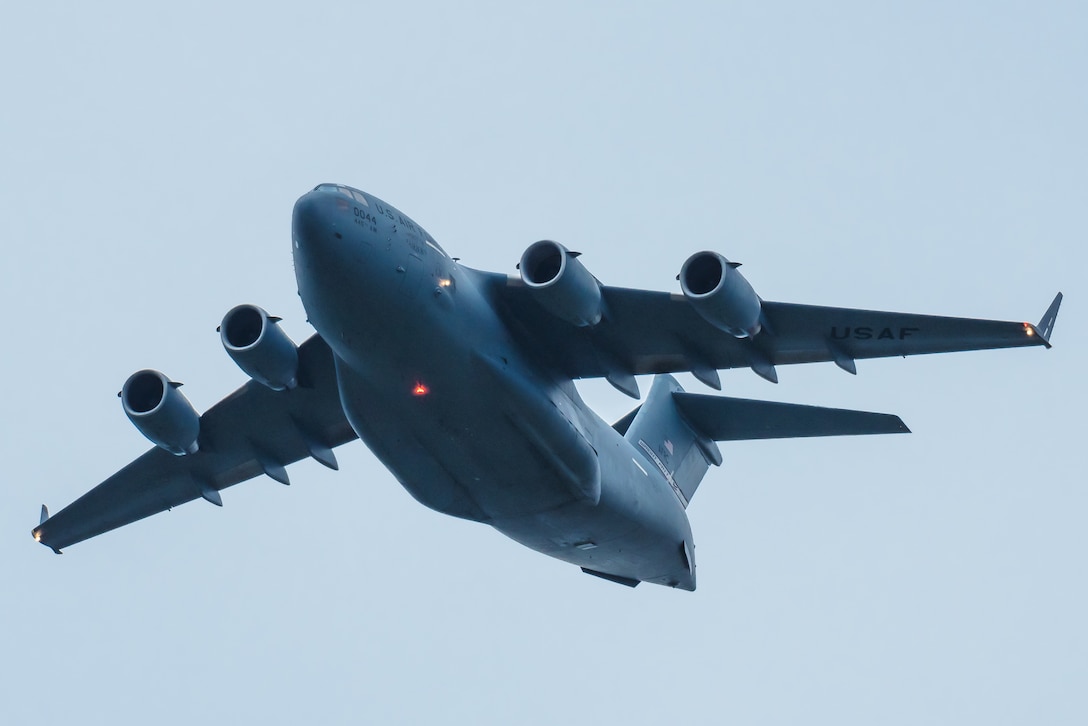 A U.S. Air Force C-17 Globemaster III performs an aerial demonstration over Bowman Field in Louisville, Ky., April 17, 2021, as part of the Thunder Over Louisville air show. The annual event featured more than 20 military and civilian air craft this year. (U.S. Air National Guard photo by Dale Greer)