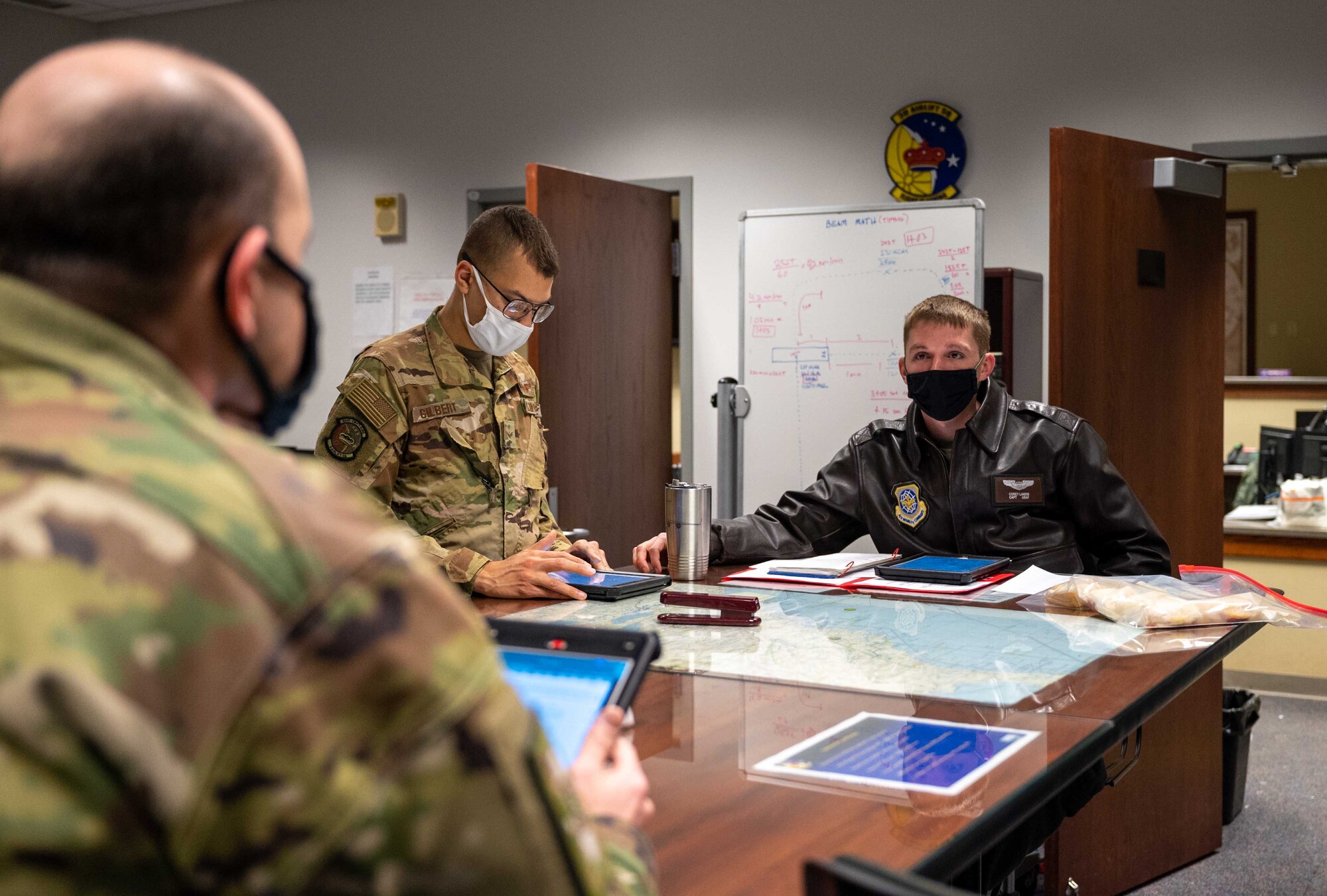 Capt. Corey Landis, right, 3rd Airlift Squadron pilot, briefs aircrew before a training mission at Dover Air Force Base, Delaware, March 16, 2021. The 3rd AS constantly trains to provide global reach with unique, outsized and oversized airlift capability. (U.S. Air Force photo by Airman 1st Class Faith Schaefer)