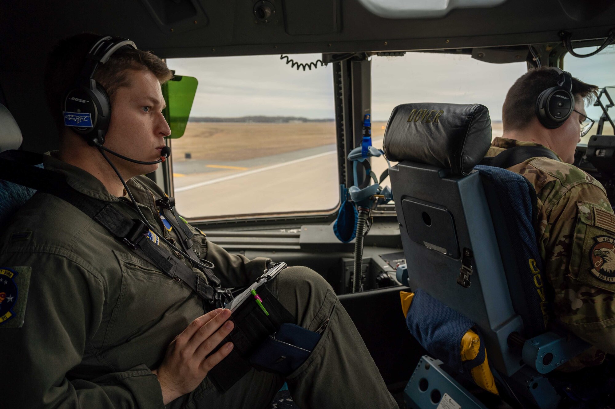 First Lt. August Hein, 3rd Airlift Squadron pilot, waits for takeoff aboard a C-17 Globemaster III at Dover Air Force Base, Delaware, March 16, 2021. The 3rd AS constantly trains to provide global reach with unique, outsized and oversized airlift capability. (U.S. Air Force photo by Airman 1st Class Faith Schaefer)