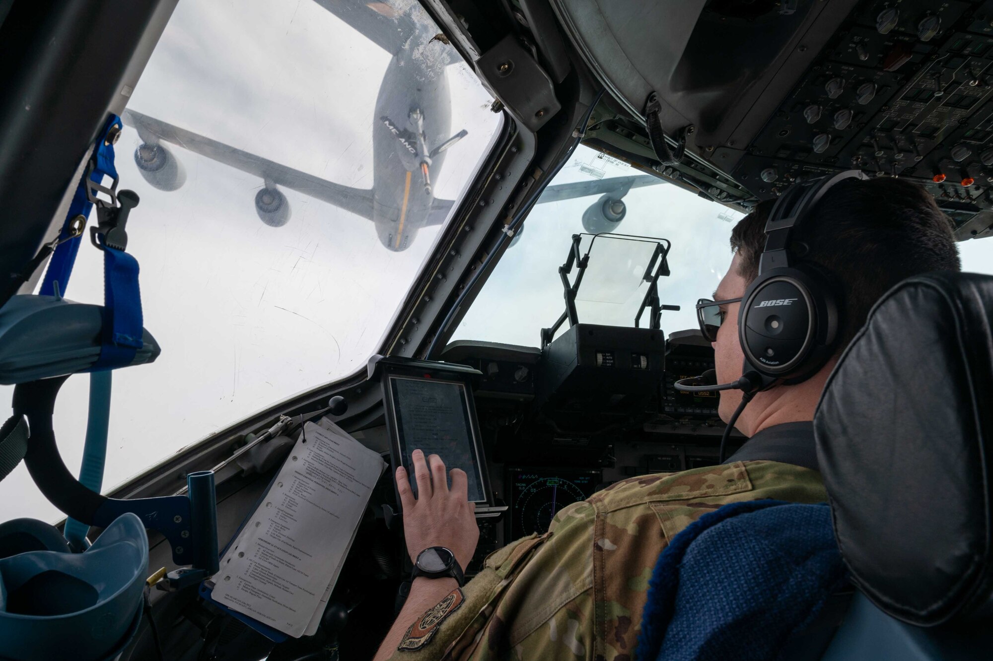 Maj. Casey Boley, 3rd Airlift Squadron pilot, prepares for an aerial refueling with a KC-135 Stratotanker assigned to the 101st Air Refueling Wing, Maine Air National Guard, March 16, 2021. The 3rd AS constantly trains to provide global reach with unique, outsized and oversized airlift capability. (U.S. Air Force photo by Airman 1st Class Faith Schaefer)