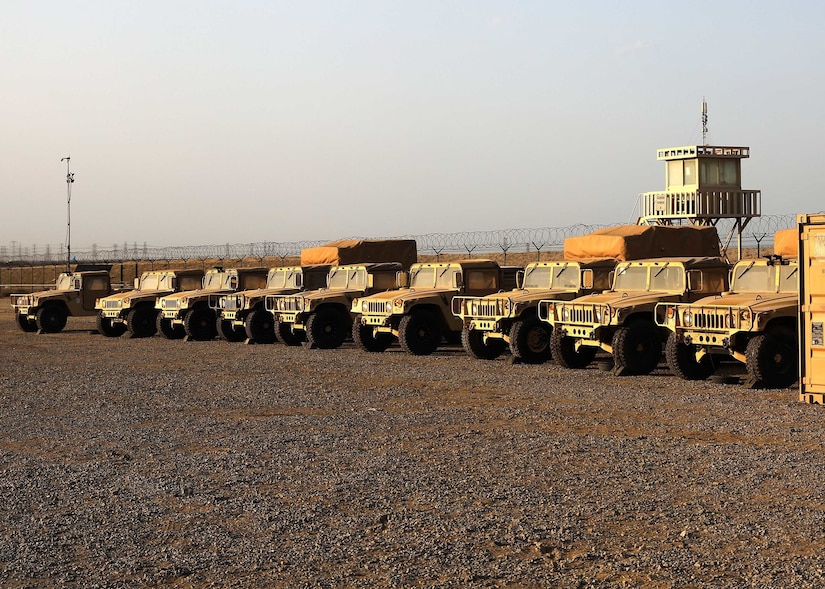 Humvees bask in the Camp Arifjan, Kuwait, sunset parked April 13, 2021 in the maintenance yard stood up by Fort Knox, Kentucky, based 1st Theater Sustainment Command Soldiers, as part of their expeditionary command post validation exercise. The ECP validation exercise included a fully capable sustainment operational center, where 1st TSC commanding general Maj. Gen. Joseph P. Sullivan, was briefed by his staff, subordinate and partner units from across the U.S. Central Command area of responsibility and in the United States. (U.S. Army photo by Staff Sgt. Neil W. McCabe)