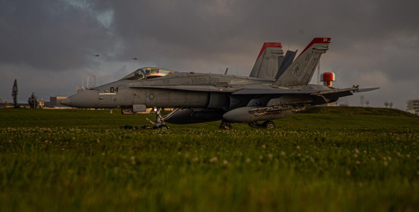 A U.S. Marine Corps F/A-18C Hornet aircraft assigned to Marine Fighter Attack Squadron 323, lands with M-31 arrestment gear during a Marine Corps Combat Readiness Evaluation conducted by Marine Wing Support Squadron 172 on Marine Corps Air Station Futenma, Okinawa, Japan, April 12, 2021.  The MCCRE creates a challenging, realistic training environment that produces combat-ready forces capable of operating as a deployed unit at any time.