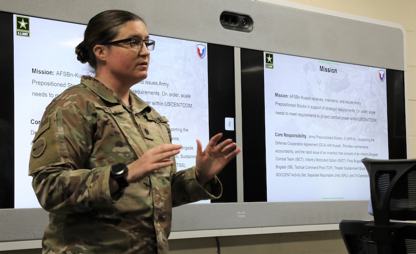Lt. Col. Nichole Vild, commander of the 401st Army Field Support Battalion-Kuwait gives a briefing about the mission and core responsibility of the 401st AFSB and the Army’s Prepositioned Stock program to the senior military advisor to the U.S. Ambassador to Kuwait and Soldiers from the 1st Theater Sustainment Command, Operational Command Post at Camp Arifjan, Kuwait on April 2, 2021. (U.S. Army photo by Capt. Elizabeth Rogers)
