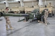 Soldiers from the 1st Theater Sustainment Command, Operational Command Post observe equipment which has been staged as part of the 401st Army Field Support Battalion-Kuwait’s and the Army’s Prepositioned Stock program at Camp Arifjan, Kuwait on April 3, 2021. (U.S. Army photo by Capt. Elizabeth Rogers)
