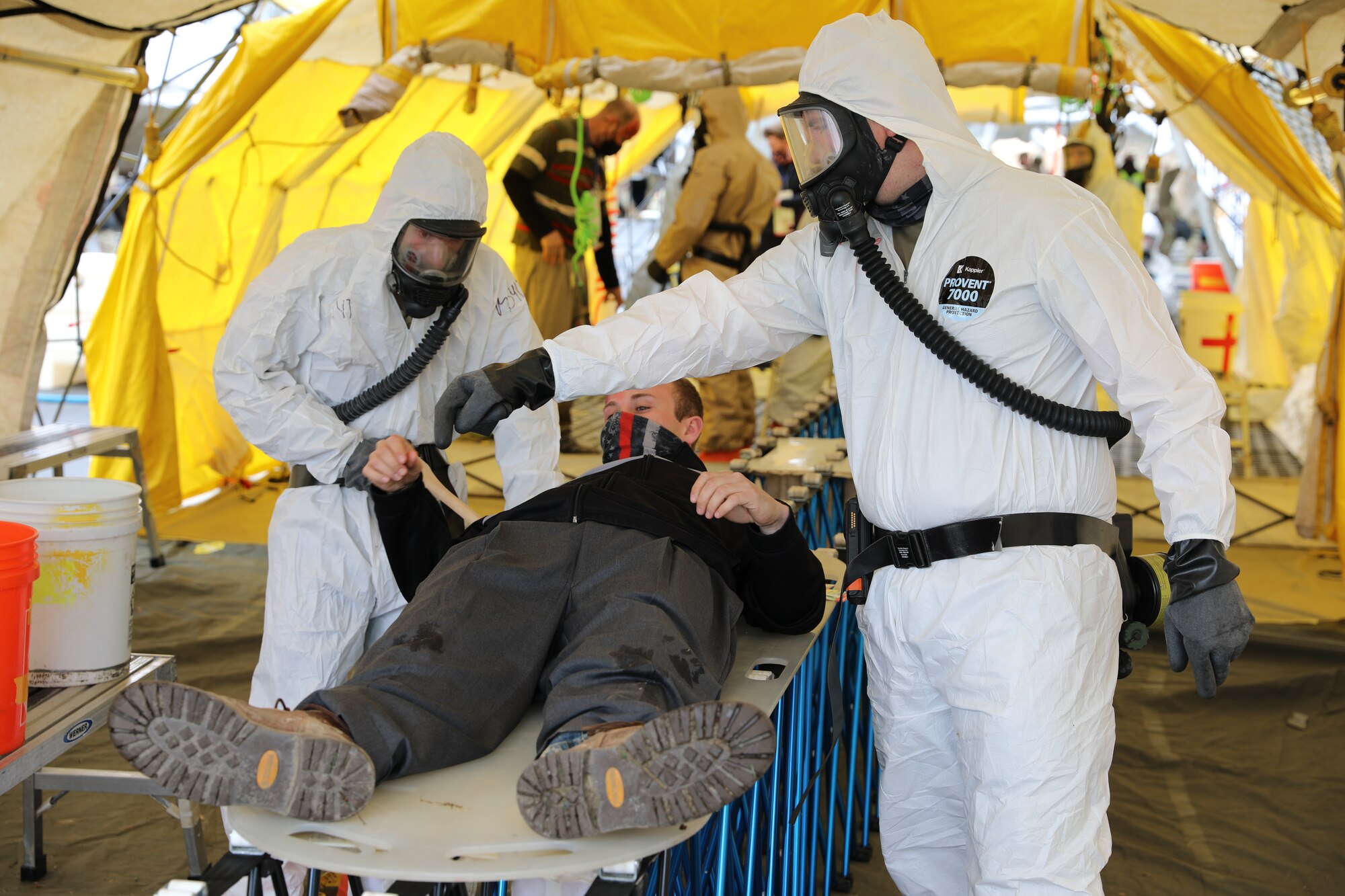 Soldiers from Alpha Company, 642nd Aviation Support Battalion of the New York Army National Guard, practice casualty decontamination with a civilian role-player during a Homeland Response Force collective training event in East Amherst, New York on April 17. The Solders are assigned as part of the decontamination element of the FEMA Region II HRF, tasked with response in the first hours and days of natural or manmade disasters. (Army National Guard Photo by Capt. Avery Schneider)