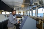 PACIFIC OCEAN (Sept. 30, 2016) A merchant mariner aboard the fast sealift ship SS Capella (T-AKR 293) mans the helm as the ship is underway to conduct a 120-hour turbo activation. The U.S. Transportation Command (TRANSCOM) conducts turbo activation to measure personnel and material readiness of the selected Ready Reserve Force. Capella, more than 40-years-old, is still among the fastest cargo ships in the world and capable of transporting nearly all equipment needed to outfit a full mechanized brigade of the U.S. Army. (U.S. Navy photo by Petty Officer 2nd Class Billy Ho/Released)