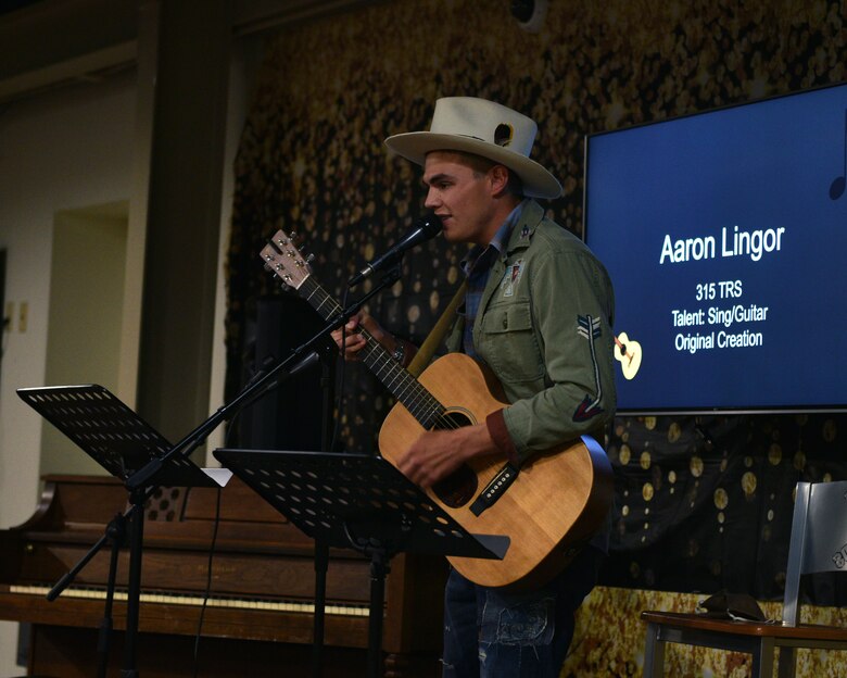 U.S. Air Force Airman 1st Class Aaron Lingor, 315th Training Squadron student, plays the guitar at Crossroads on Goodfellow Air Force Base, Texas, April 16, 2021. Lingor has released two albums and performed one of his own original songs. (U.S. Air Force photo by Senior Airman Ashley Thrash)