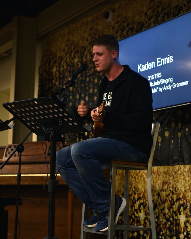 U.S. Air Force Airman Basic Kaden Ennis, 316th Training Squadron student, performs a ukulele cover of “Don’t Give Up On Me” by Andy Grammar at Crossroads on Goodfellow Air Force Base, Texas, April 16, 2021. Ennis is a self-taught ukulele player; he plans on learning the guitar next. (U.S. Air Force photo by Senior Airman Ashley Thrash)