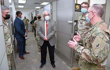 Col. James Jones (far right), Interservice Physician Assistant Program Associate professor, briefs J.M. Harmon III, deputy to the U.S. Army Medical Center of Excellence commanding general, on the renovations and new furniture to their program area.