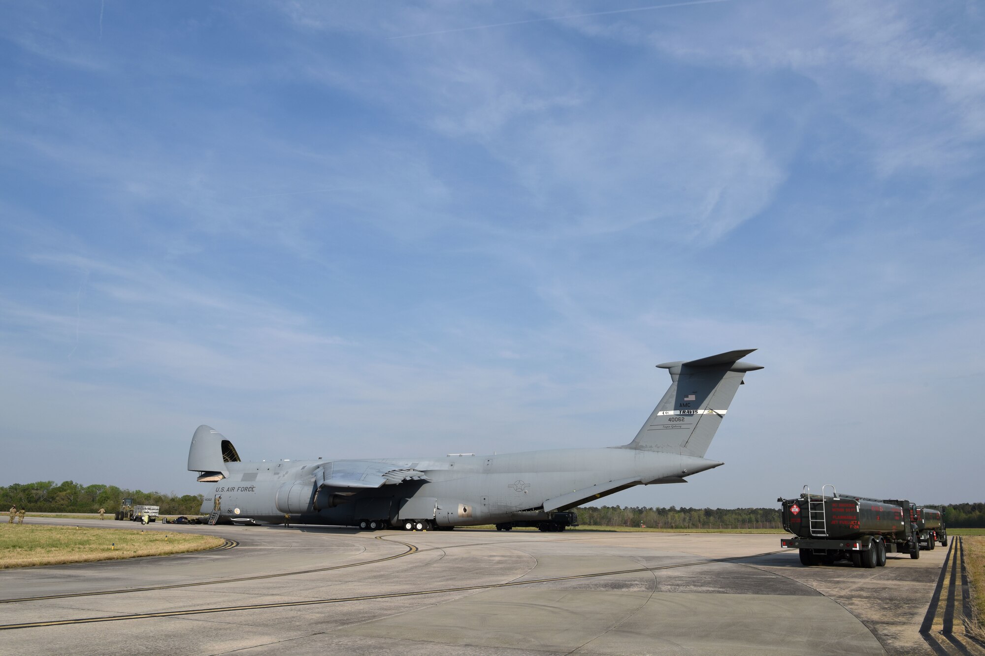 U.S. Air Force equipment load crewmembers from the 169th Logistics Readiness Squadron and C-5 Super Galaxy aircrew from the 312th Airlift Squadron from Travis Air Force Base, California, load palletized equipment onto the heavy transport aircraft at McEntire Joint National Guard Base, South Carolina, as the South Carolina Air Naitonal Guard's 169th Fighter Wing prepares for an Air and Space Force Expeditionary Force deployment to an undisclosed location in Southwest Asia, April 8, 2021. (U.S. Air National Guard photo by Senior Master Sgt. Edward Snyder, 169th Fighter Wing Public Affairs)