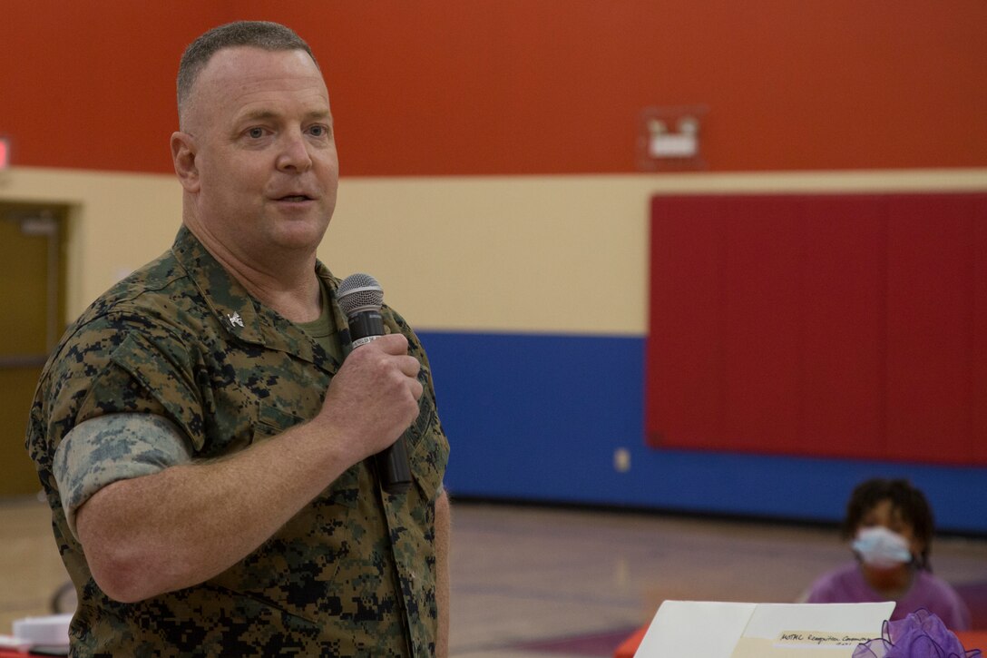 U.S. Marine Corps Col. Chuck Dudik, commanding officer of Marine Corps Air Station (MCAS) Yuma, addresses military children at the Youth Center on MCAS Yuma, Ariz., April 14, 2021. The ceremony was held to honor military children by highlighting their unique experiences. (U.S. Marine Corps photo by Cpl. Joseph Exner)