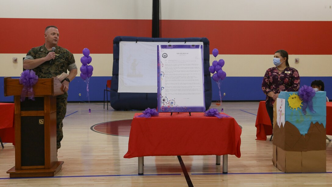 U.S. Marine Corps Col. Chuck Dudik, commanding officer of Marine Corps Air Station (MCAS) Yuma, addresses military children at the Youth Center on MCAS Yuma, Ariz., April 14, 2021. The ceremony was held to honor military children by highlighting their unique experiences. (U.S. Marine Corps photos by Cpl. Joseph Exner)