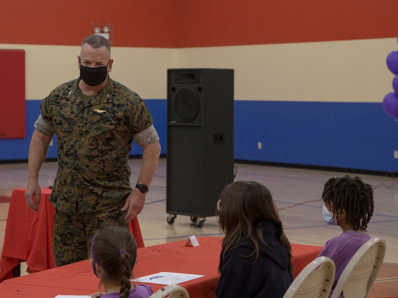 U.S. Marine Corps Col. Chuck Dudik, commanding officer of Marine Corps Air Station (MCAS) Yuma, addresses military children at the Youth Center on MCAS Yuma, Ariz., April 14, 2021. The ceremony was held to honor military children by highlighting their unique experiences. (U.S. Marine Corps photo by Cpl. Joseph Exner)