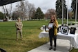 Ginger Livingston of Ginger Snaps Photography (right) received a Seven Seals Award by officials from the Utah Committee of Employer Support of the Guard and Reserve at Veteran’s Memorial Park in Provo, Utah, April 15, 2021. Staff Sgt. Jullienne Labrum (left) a Basic Leader Course instructor with the 640th Regiment-Regional Training Institute, nominated Livingston for the award for the support she received from her while deployed to the Middle East. Livingston surprised Labrum with over 1600 photos of her son that were taken over the 12-month period that she was deployed. (U.S. Army Photo by Sgt. 1st Class John Etheridge)