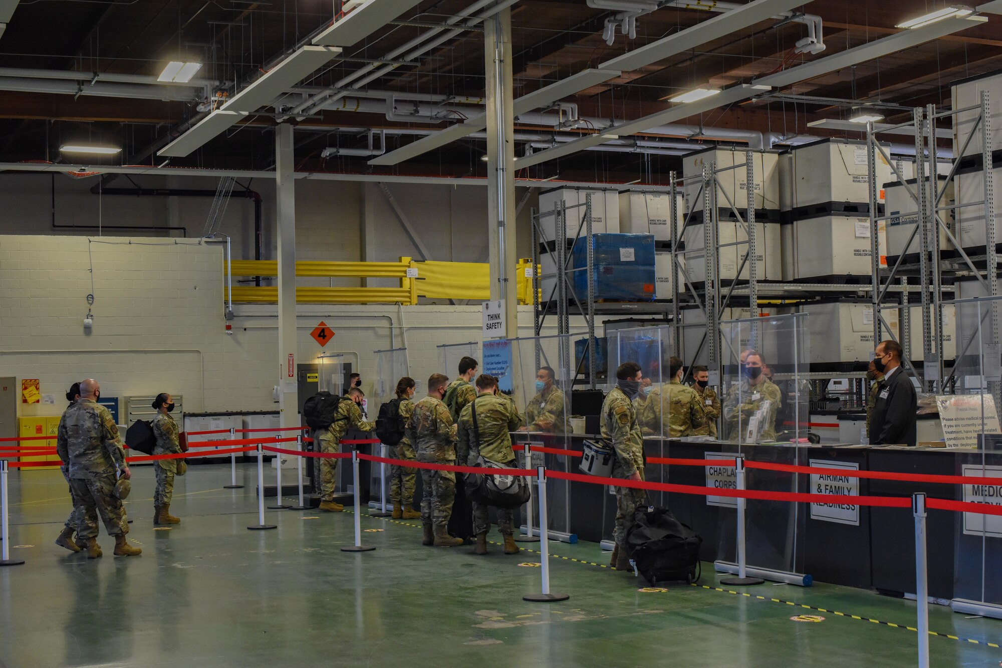 U.S. Air Force Airmen outprocess through the deployment line for Exercise Rainer War at Joint Base Lewis-McChord, Washington, April 20, 2021. Exercise Rainier War tests the 62nd Airlift Wing’s capability to plan, generate and execute a deployment tasking, sustain contingency operations, demonstrate full spectrum readiness while in a contested, degraded and operationally limited environment. (U.S. Air Force photo by Airman Charles Casner)