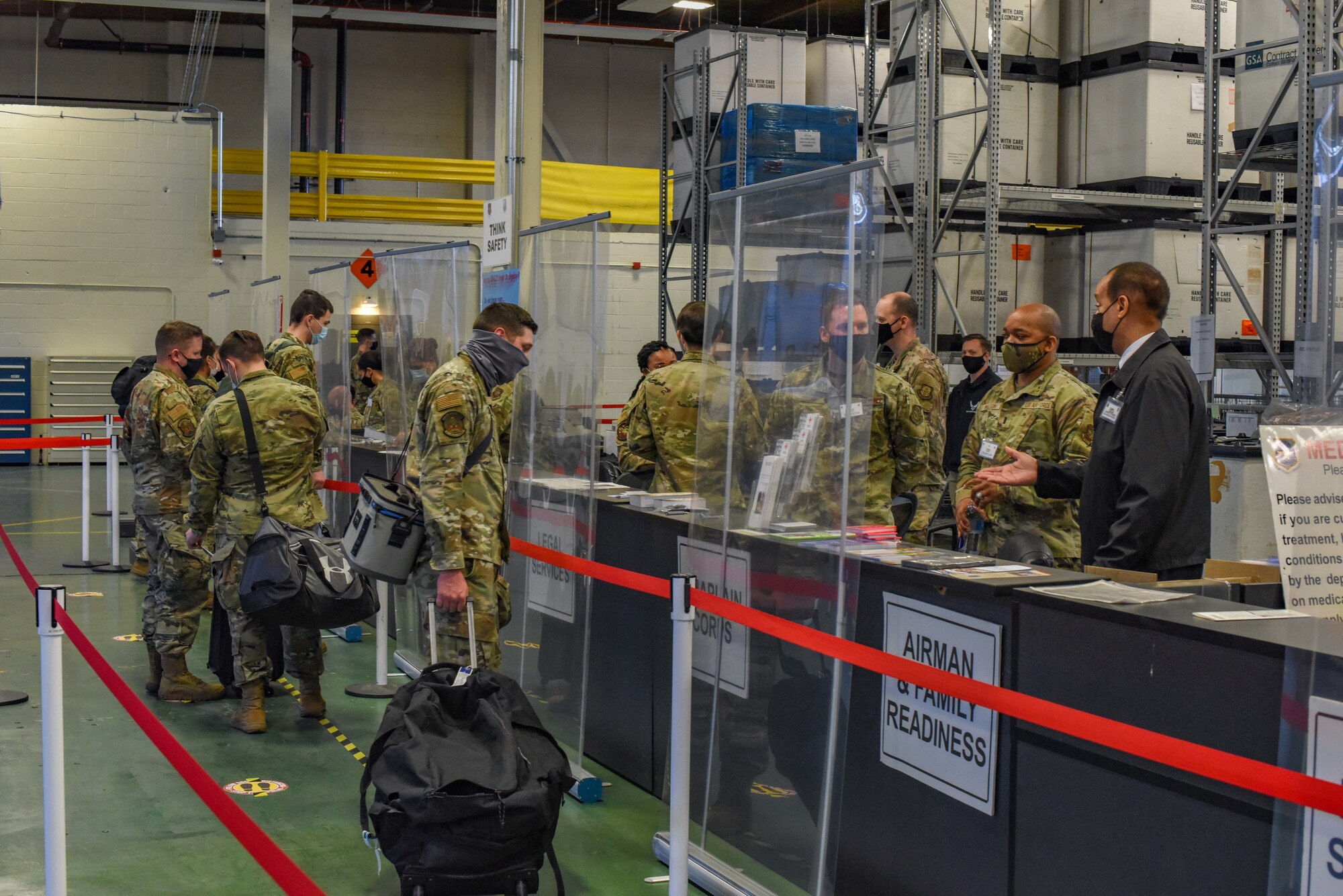 Airmen outprocess through a deployment line during Exercise Rainer War at Joint Base Lewis-McChord, Washington, April 20, 2021. Exercise Rainier War tests the 62nd Airlift Wing’s capability to plan, generate and execute a deployment tasking, sustain contingency operations, demonstrate full spectrum readiness while in a contested, degraded and operationally limited environment. (U.S. Air Force photo by Airman Charles Casner)