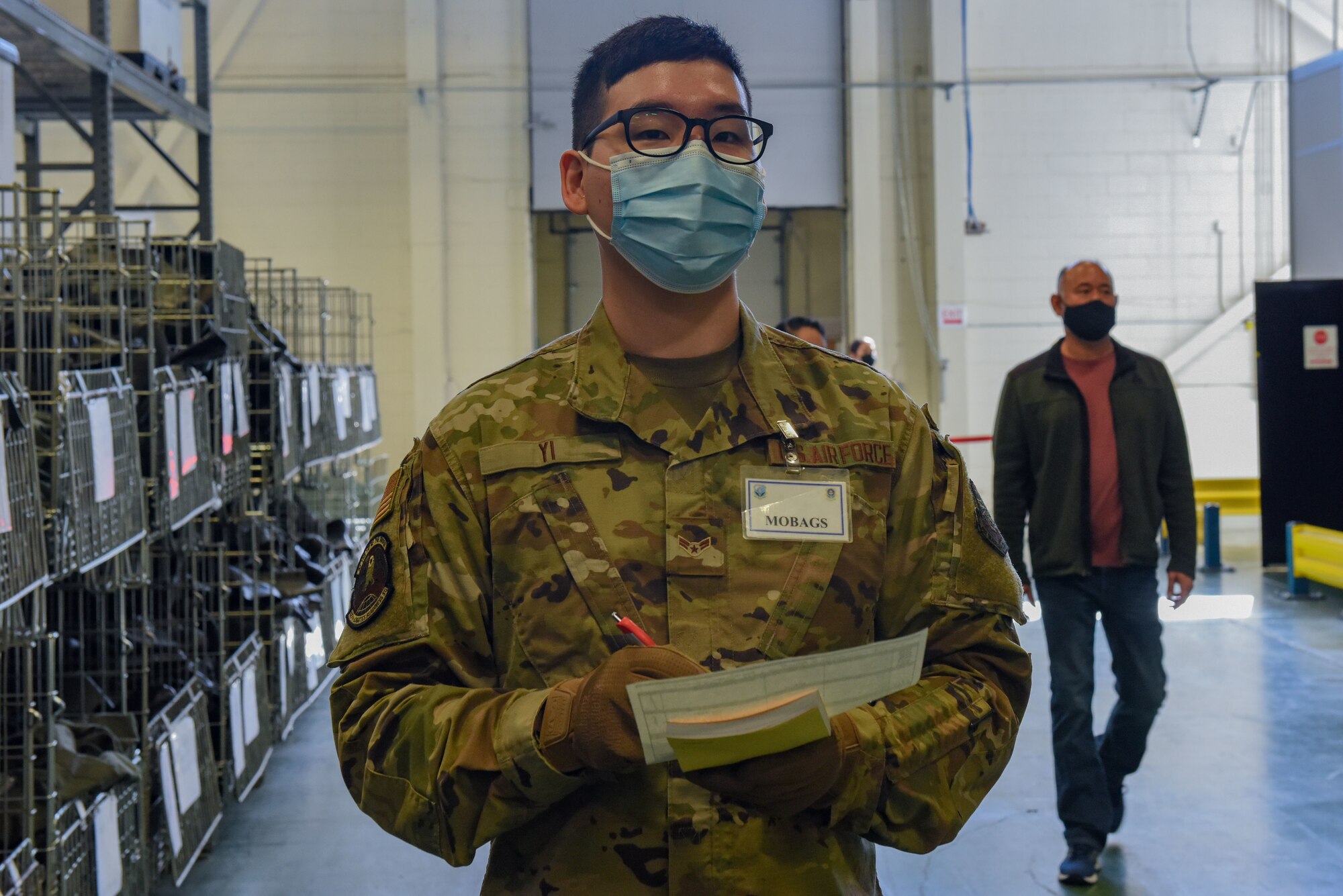 U.S. Air Force Airman 1st Class Toby Yi, a material management Airman with the 627th Logistics Readiness Squadron, checks the equipment roster for Exercise Rainier War at Joint Base Lewis-McChord, Washington, April 20, 2021. Exercise Rainier War tests the 62nd Airlift Wing’s capability to plan, generate and execute a deployment tasking, sustain contingency operations, demonstrate full spectrum readiness while in a contested, degraded and operationally limited environment. (U.S. Air Force photo by Airman Charles Casner)