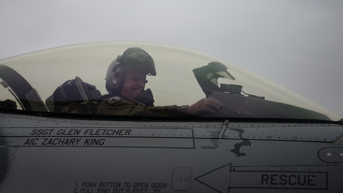 A pilot flashes a 'crush 'em' sign.