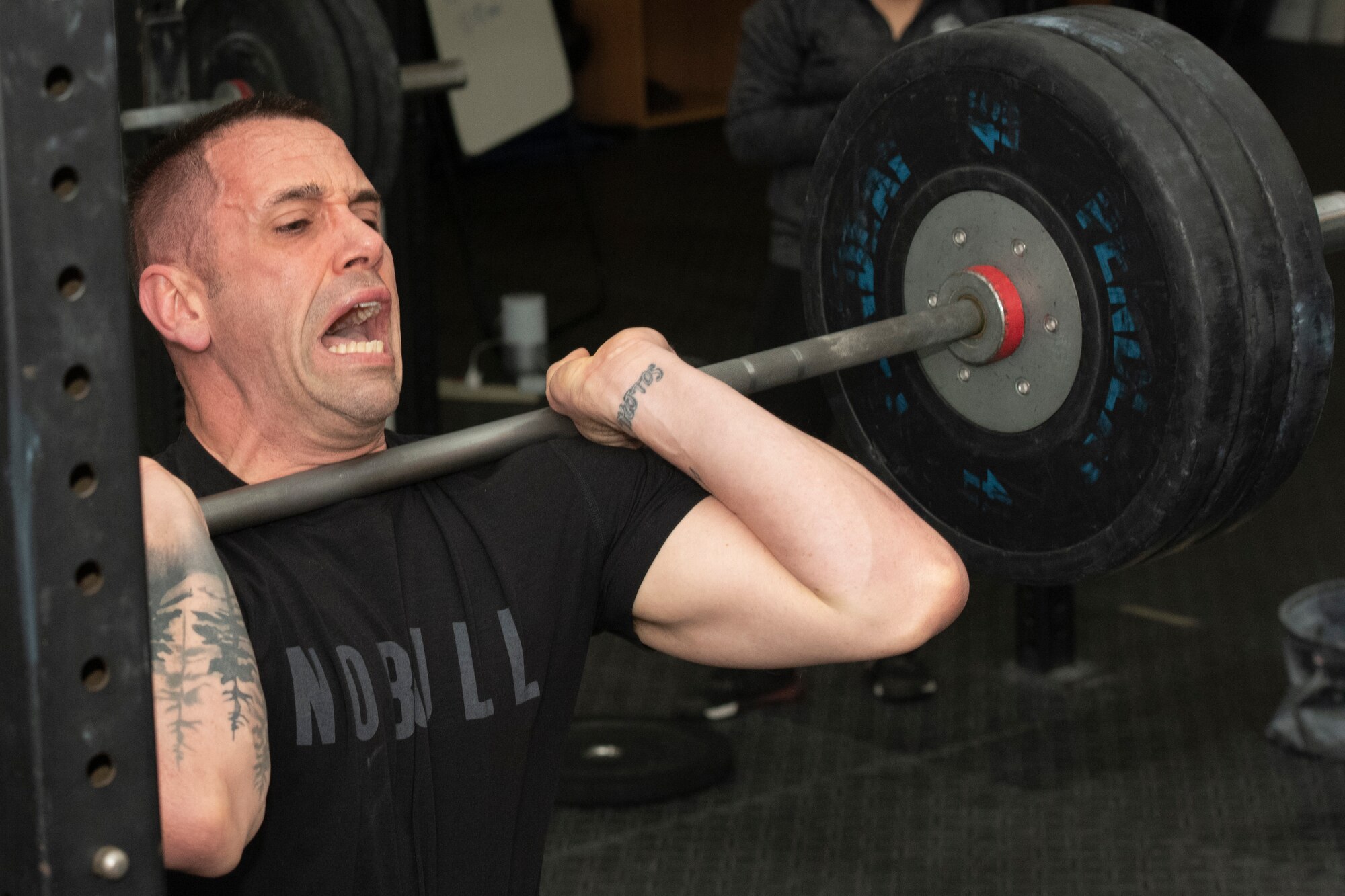 Staff Sgt. Cole Gastel, 51st Civil Engineer Squadron fire crew chief, uses a rowing machine as part of his CrossFit Games quarterfinals workouts on Osan Air Base, Republic of Korea, April 10, 2021. The quarterfinals portion of the CrossFit Games consists of a series of five scored workout routines that took place over three days. (U.S. Air Force photo by Staff Sgt. Douglas Lorance).