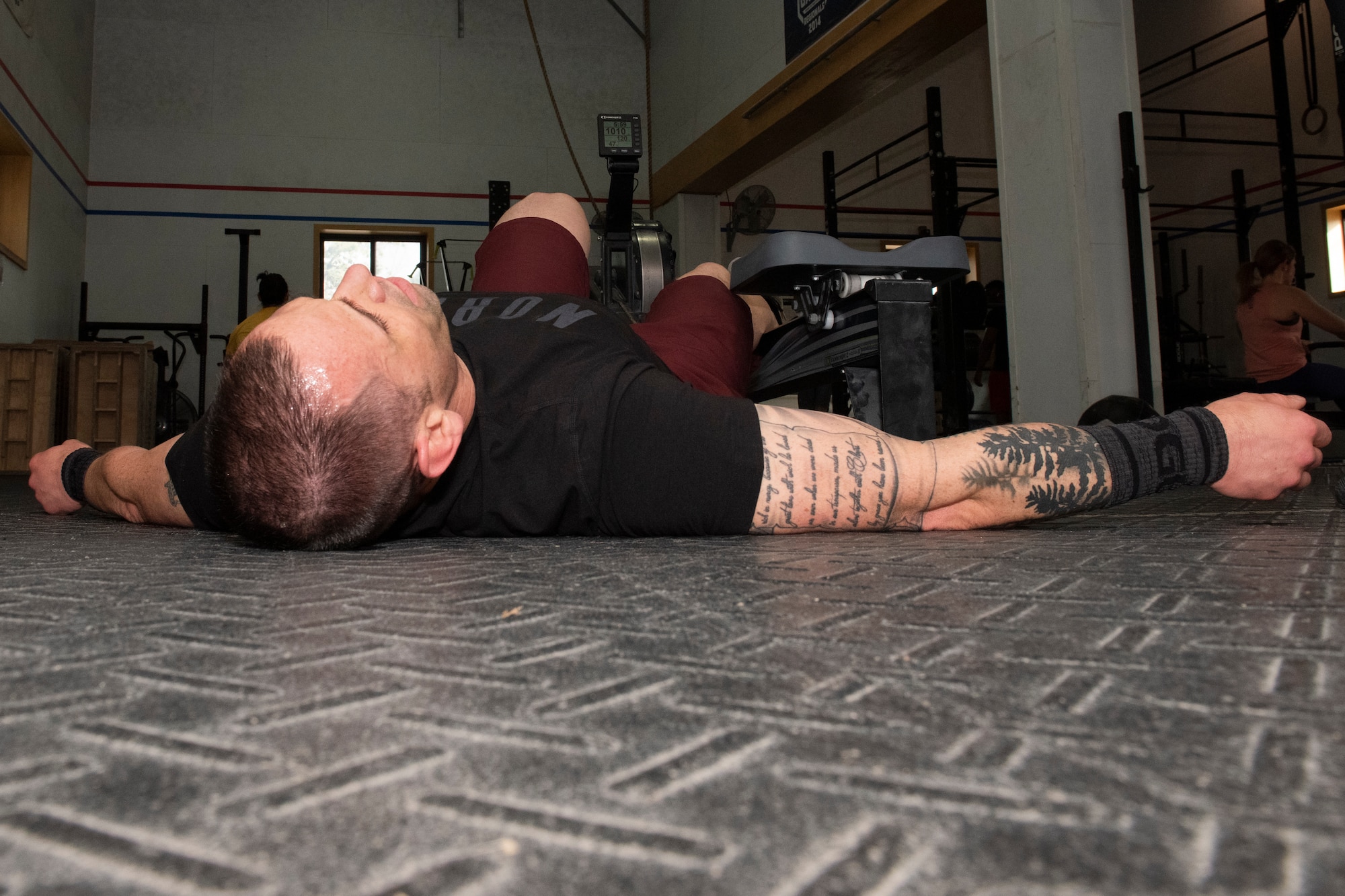 Staff Sgt. Cole Gastel, 51st Civil Engineer Squadron fire crew chief, uses a rowing machine as part of his CrossFit Games quarterfinals workouts on Osan Air Base, Republic of Korea, April 10, 2021. The quarterfinals portion of the CrossFit Games consists of a series of five scored workout routines that took place over three days. (U.S. Air Force photo by Staff Sgt. Douglas Lorance).