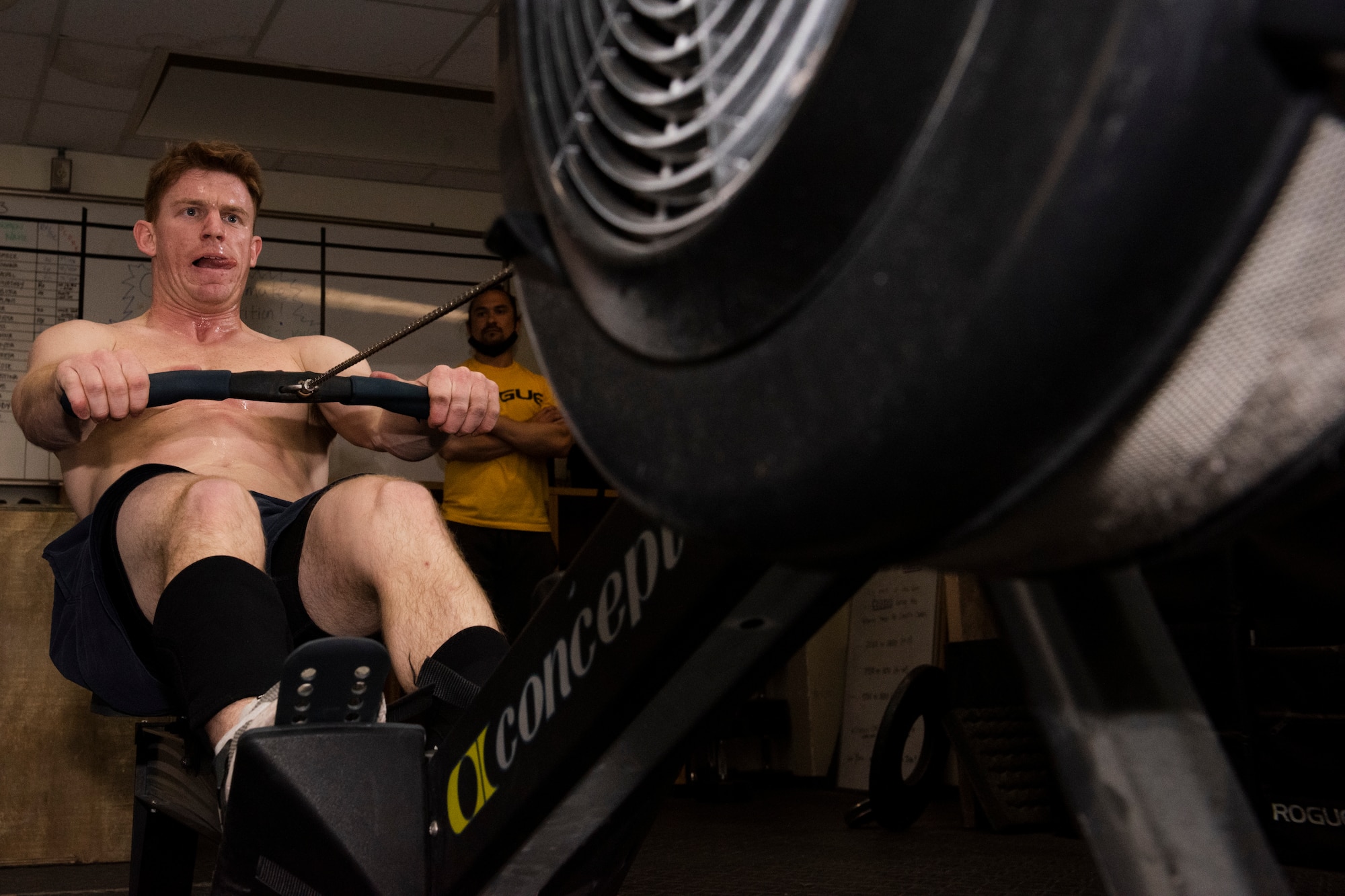 Staff Sgt. Cole Gastel, 51st Civil Engineer Squadron fire crew chief, uses a rowing machine as part of his CrossFit Games quarterfinals workouts on Osan Air Base, Republic of Korea, April 10, 2021. The quarterfinals portion of the CrossFit Games consists of a series of five scored workout routines that took place over three days. (U.S. Air Force photo by Staff Sgt. Douglas Lorance).