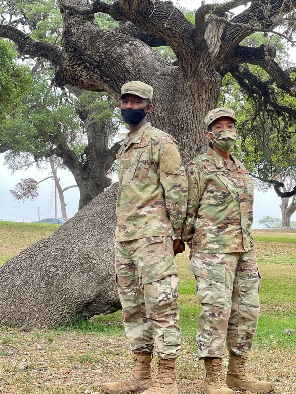 Tech. Sgt. Nessie McCray, 344th Training Squadron, and her son, Airman Basic Jaylen Netterville, 343rd Training Squadron, are shown at Joint Base San Antonio-Lackland, Texas, April 15, 2021. Both look forward to graduating and beginning their new careers. (U.S. Air Force photo by Agnes Koterba)
