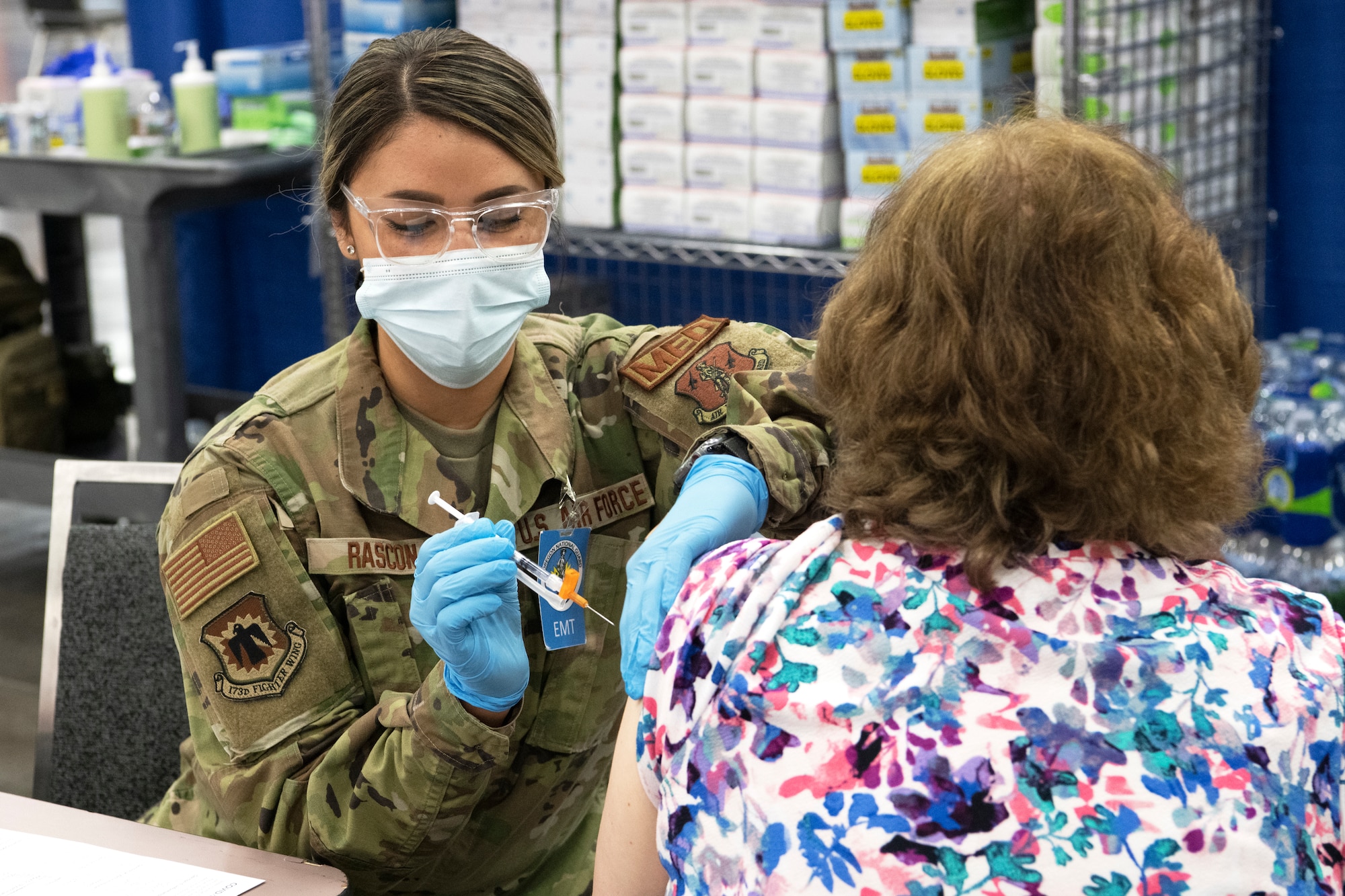 Oregon National Guard Airman 1st Class Yvette Rascon, assigned to the 173rd Fighter Wing, administers the COVID-19 vaccine during a mass vaccination clinic at the Oregon Convention Center, Portland, Ore., April 19, 2021. Oregon Guardsmen have administered almost 300,000 vaccinations.
