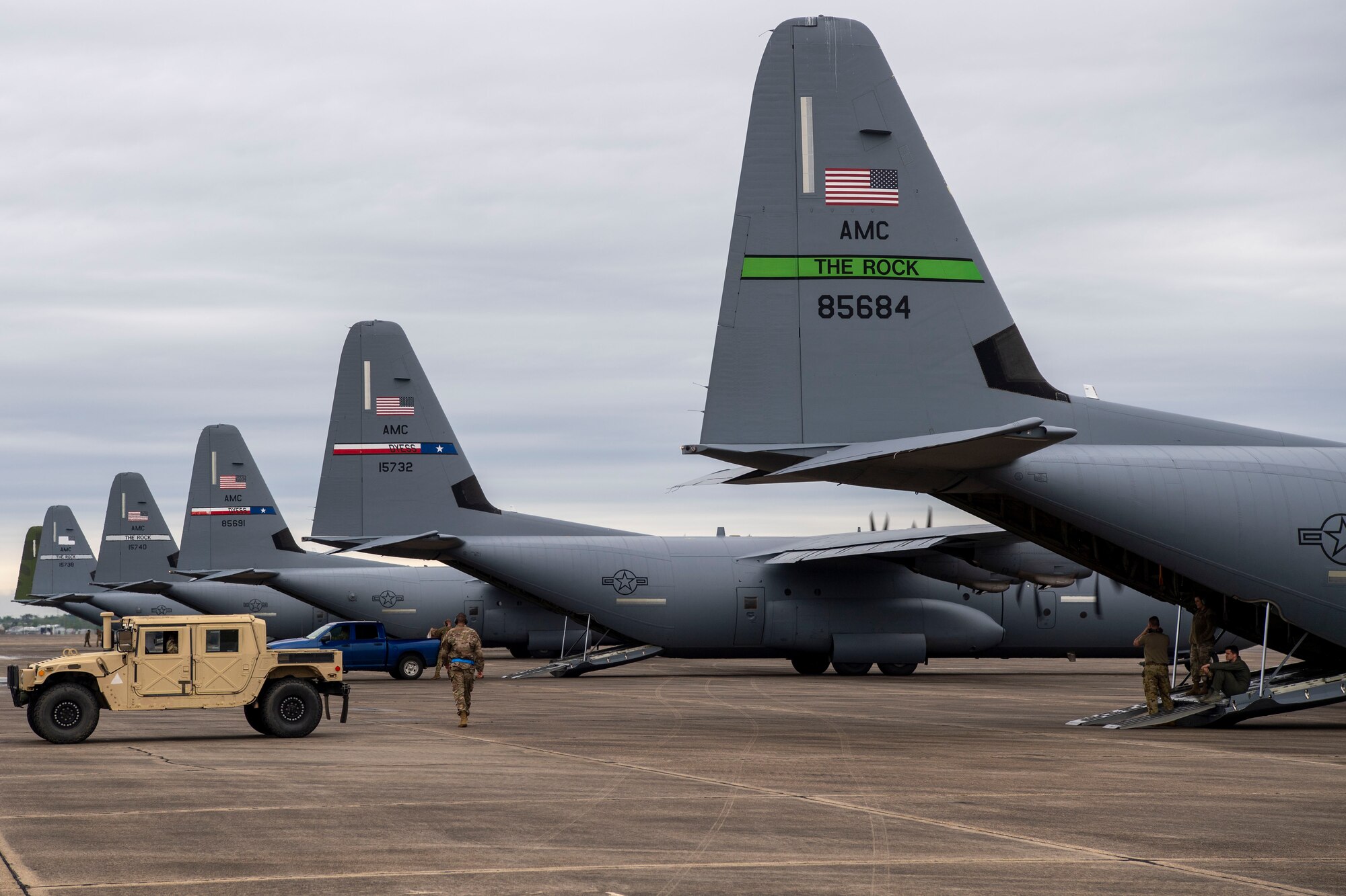 C-130Js sit on the flightline