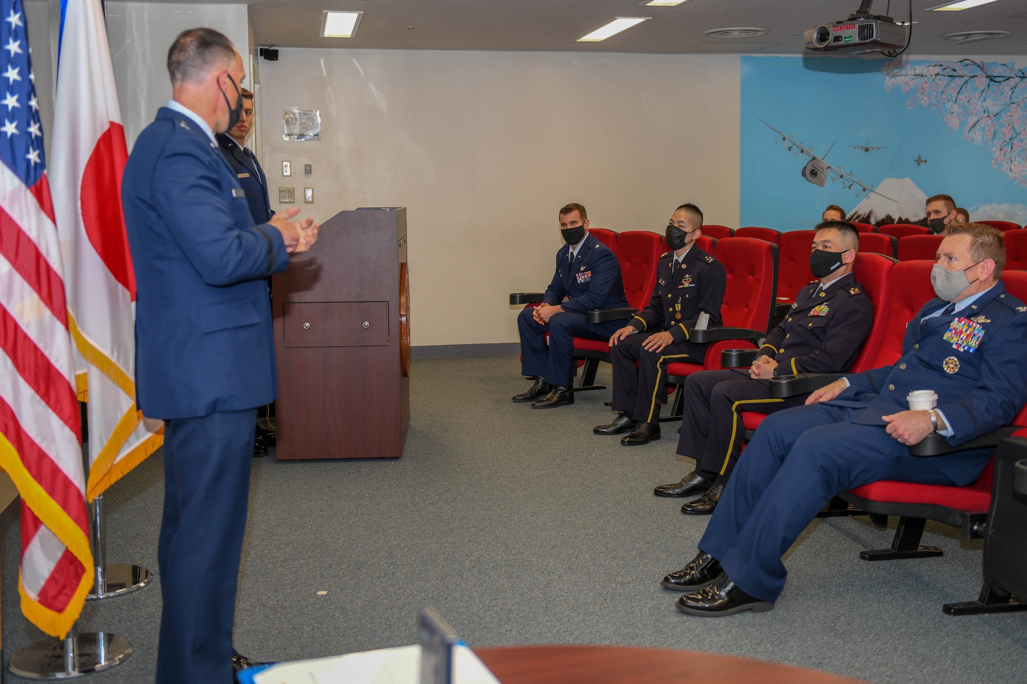 Brig. Gen. Leonard Kosinski gives remarks during an award ceremony praising Capt. Ryosuke Taki