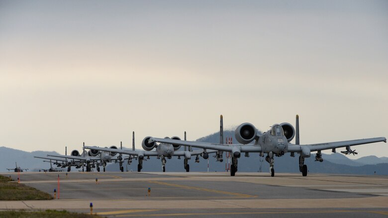 A-10s taxi down the runway.