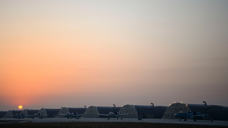 A-10 jets sit on the flightline.