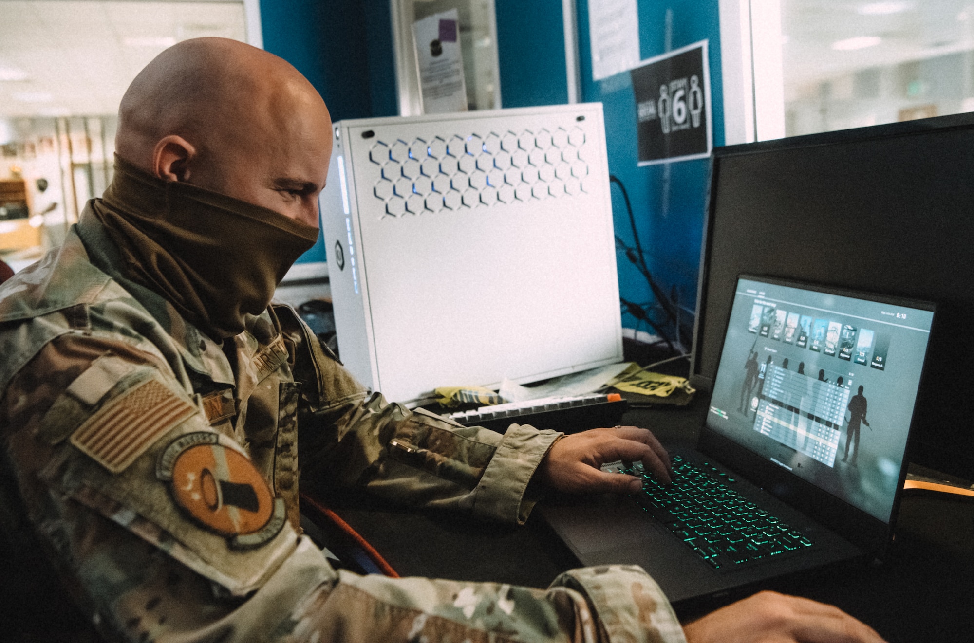 a man sits at a computer and games