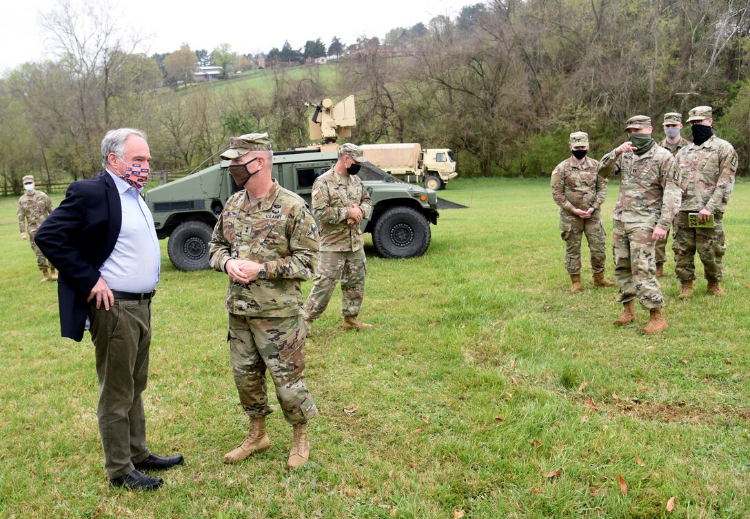 U.S. Sen. Tim Kaine visits with and thanks Virginia National Guard Soldiers assigned to the Rocky Mount-based 229th Chemical Company, 1030th Transportation Battalion, 329th Regional Support Group during a ceremony April 10, 2021, in Rocky Mount, Virginia.