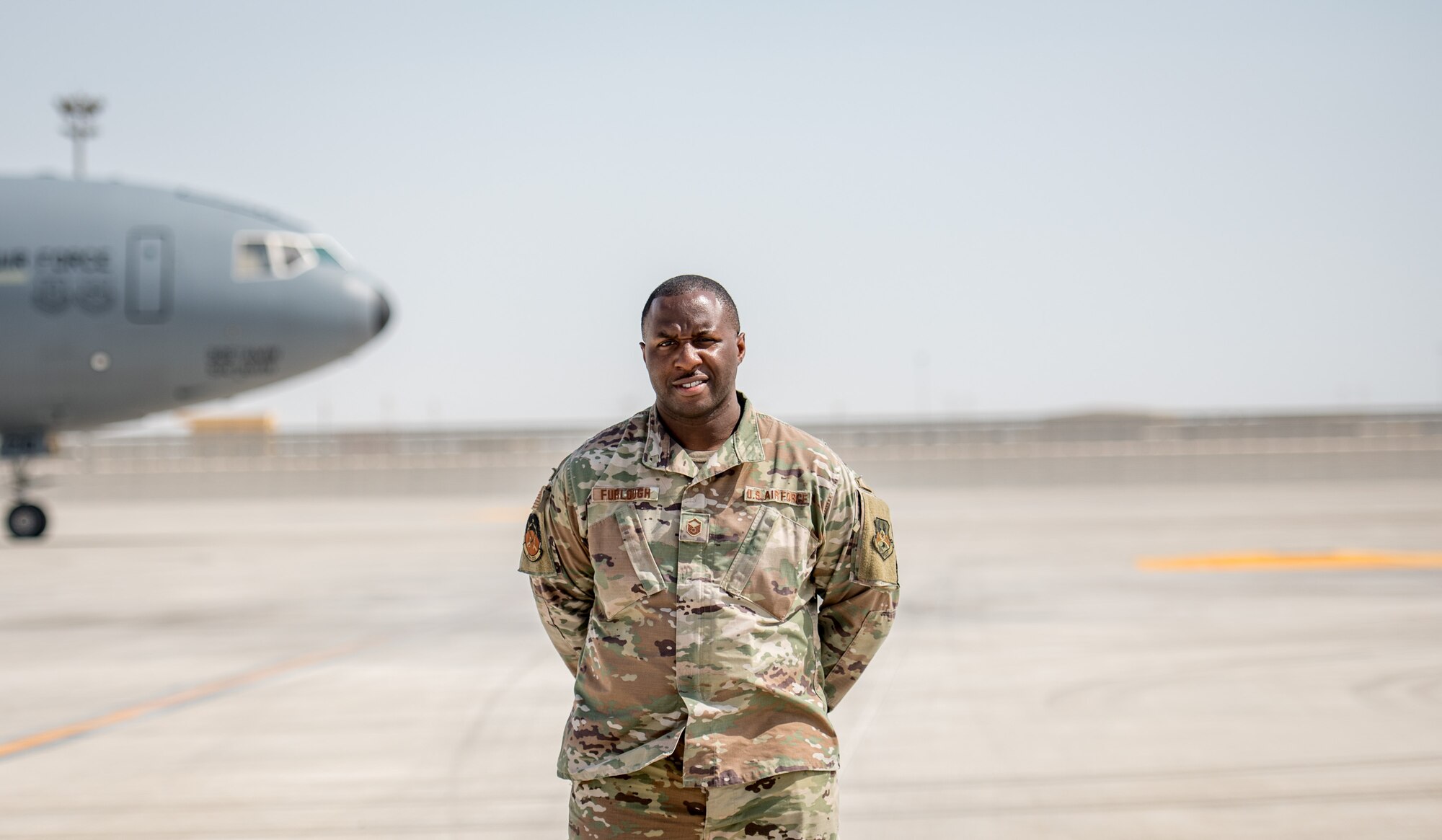 an airman poses for a portrait