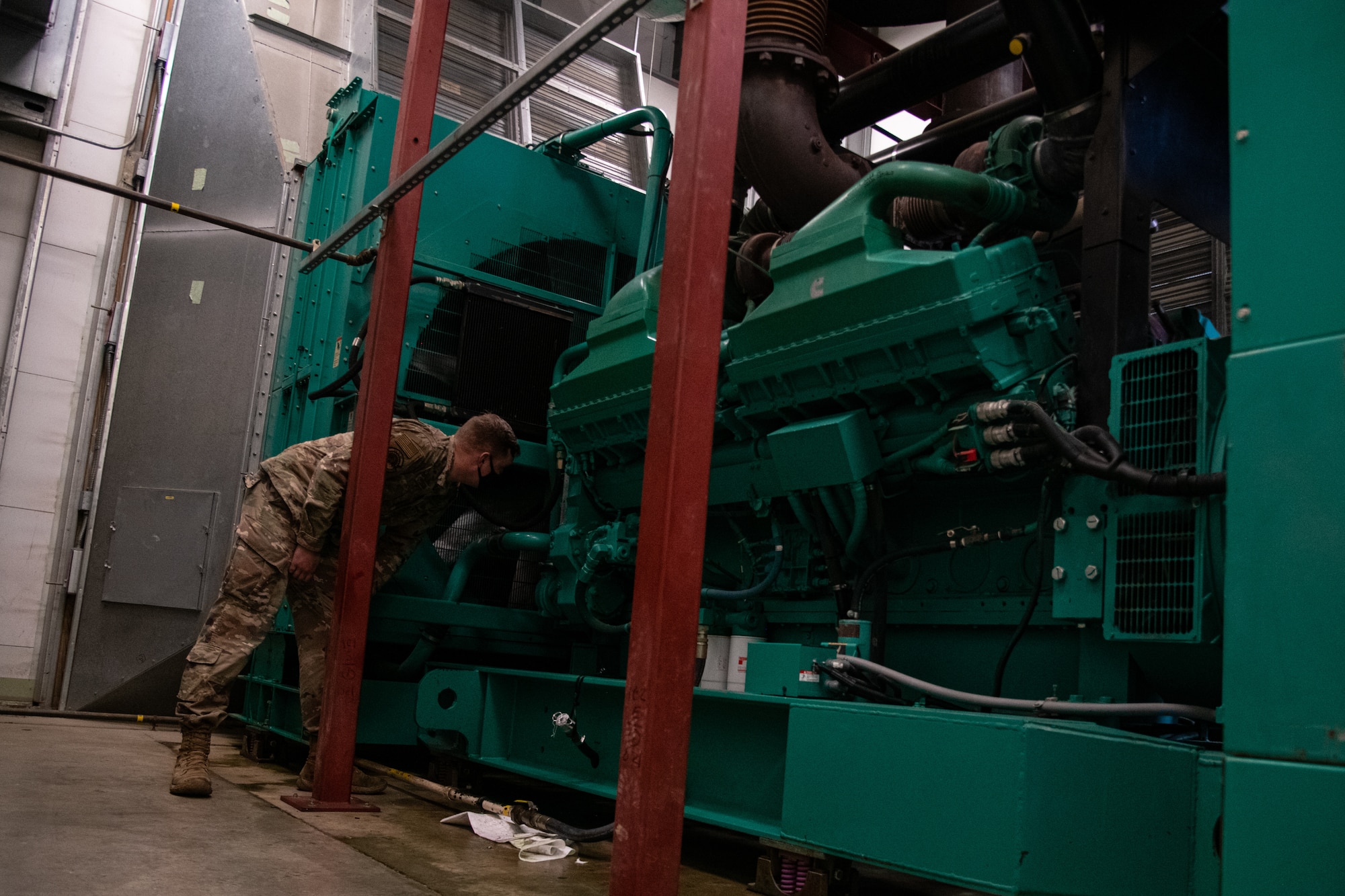 Staff Sgt. David Peterson, 436th Civil Engineer Squadron electrical power production craftsman, performs a post-test inspection on a generator at Dover Air Force Base, Delaware, April 12, 2021. Post-test checks are conducted during preventive maintenance after a generator runs for an hour. (U.S. Air Force photo by Senior Airman Marco A. Gomez)