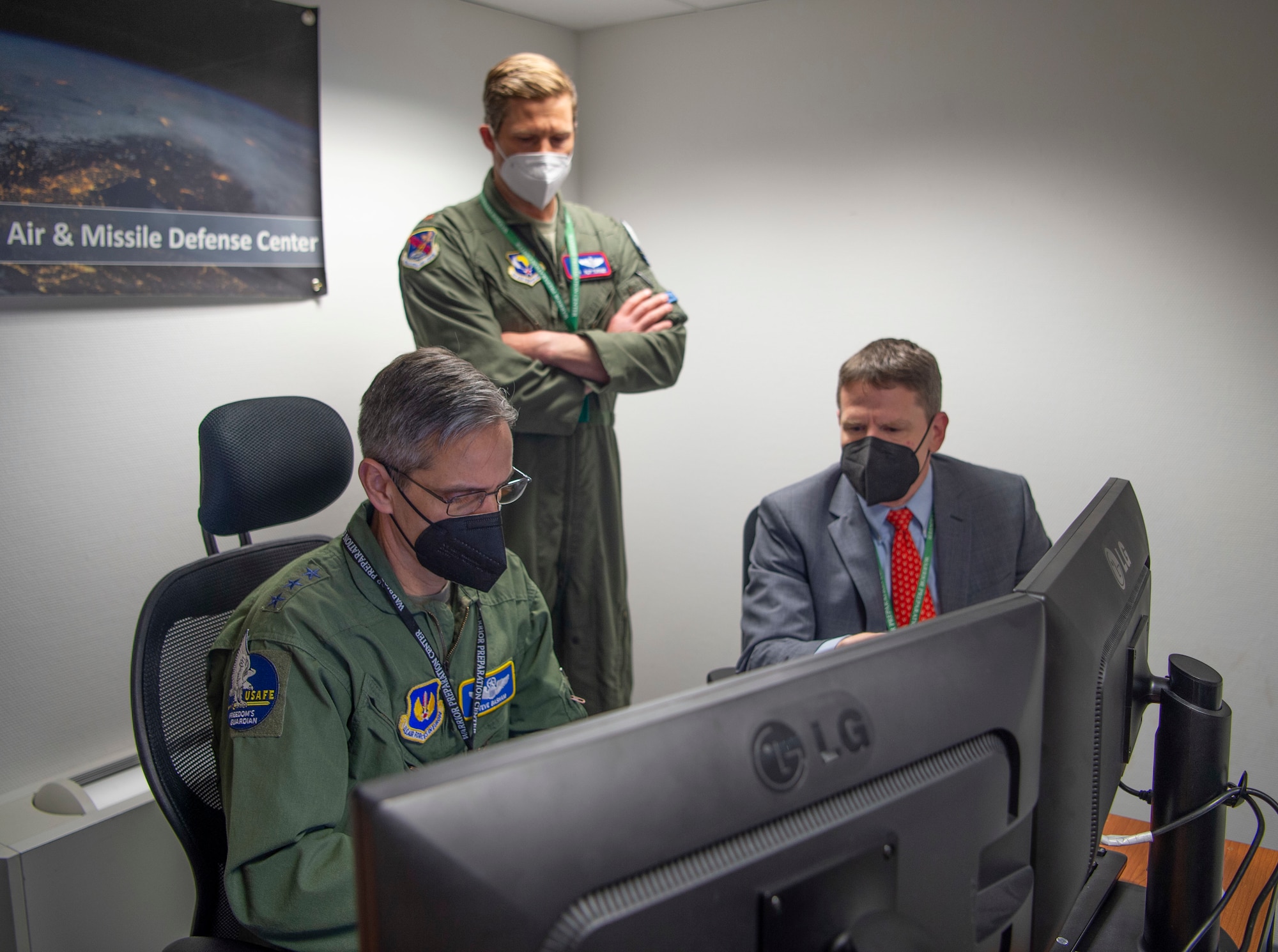 Lt. Gen. Steven Basham, U.S. Air Forces in Europe-Air Forces Africa deputy commander, discusses the European Test Bed exercise specifics before participating with an A38 training officer and Matthew Langley, ballistic missile defense subject matter expert,  Einsiedlerhof Air Station, April 12, 2021. ETB is an experimentation venue where the US and NATO can evaluate new concepts and defensive strategies to defend Europe from air and missile attacks.