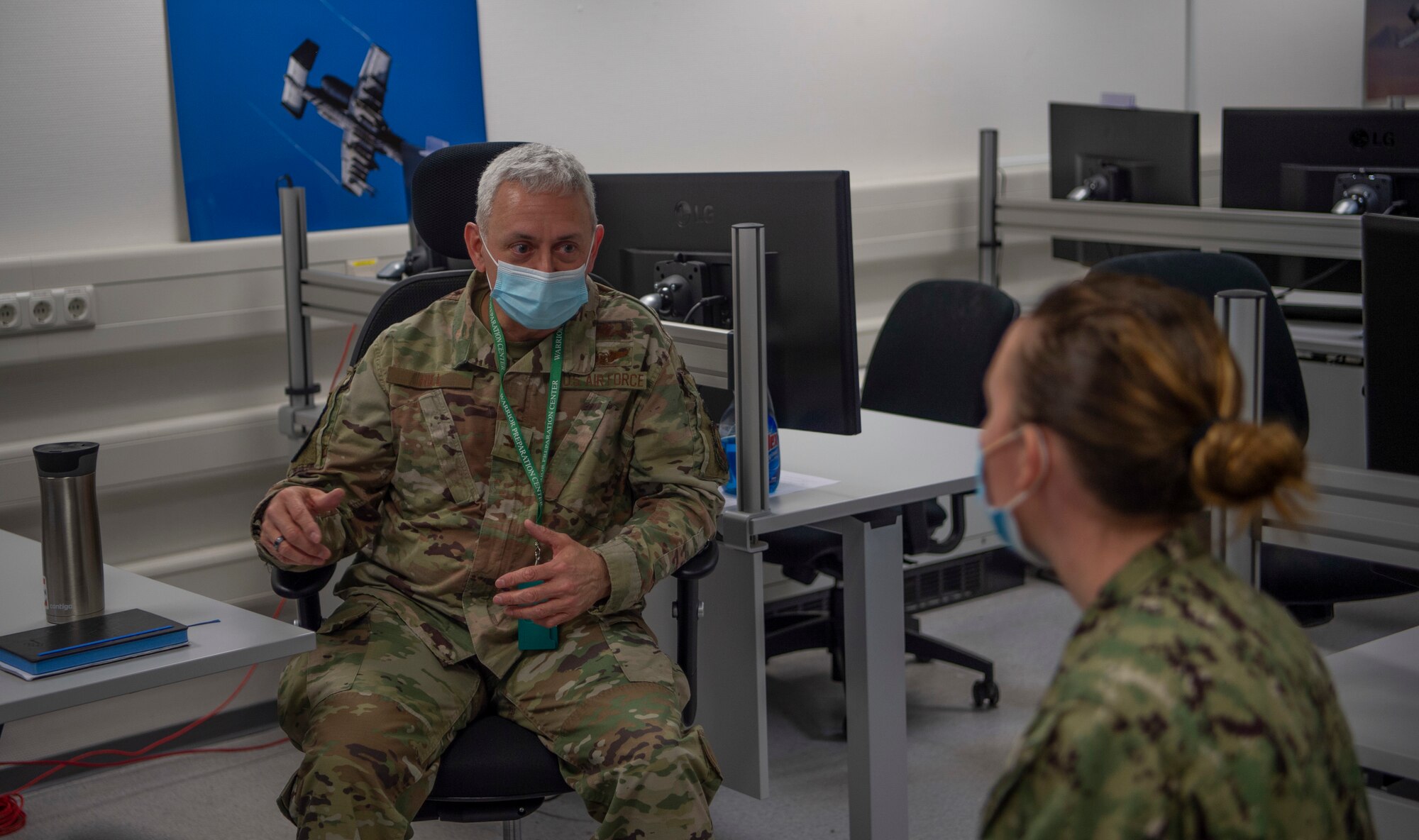 Col. William Hill, U.S. Air Forces in Europe-Air Forces Africa Cyberspace Forces director, discusses the European Test Bed exercise with U.S. Navy Lt. Logan Wilk, Combined Task Force-64 European Ballistic Missile Defense Lead at Einsiedlerhof Air Station, April 15, 2021. ETB is an experimentation venue where the US and NATO can evaluate new concepts and defensive strategies to defend Europe from air and missile attacks.