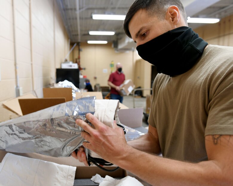 Man inspecting material