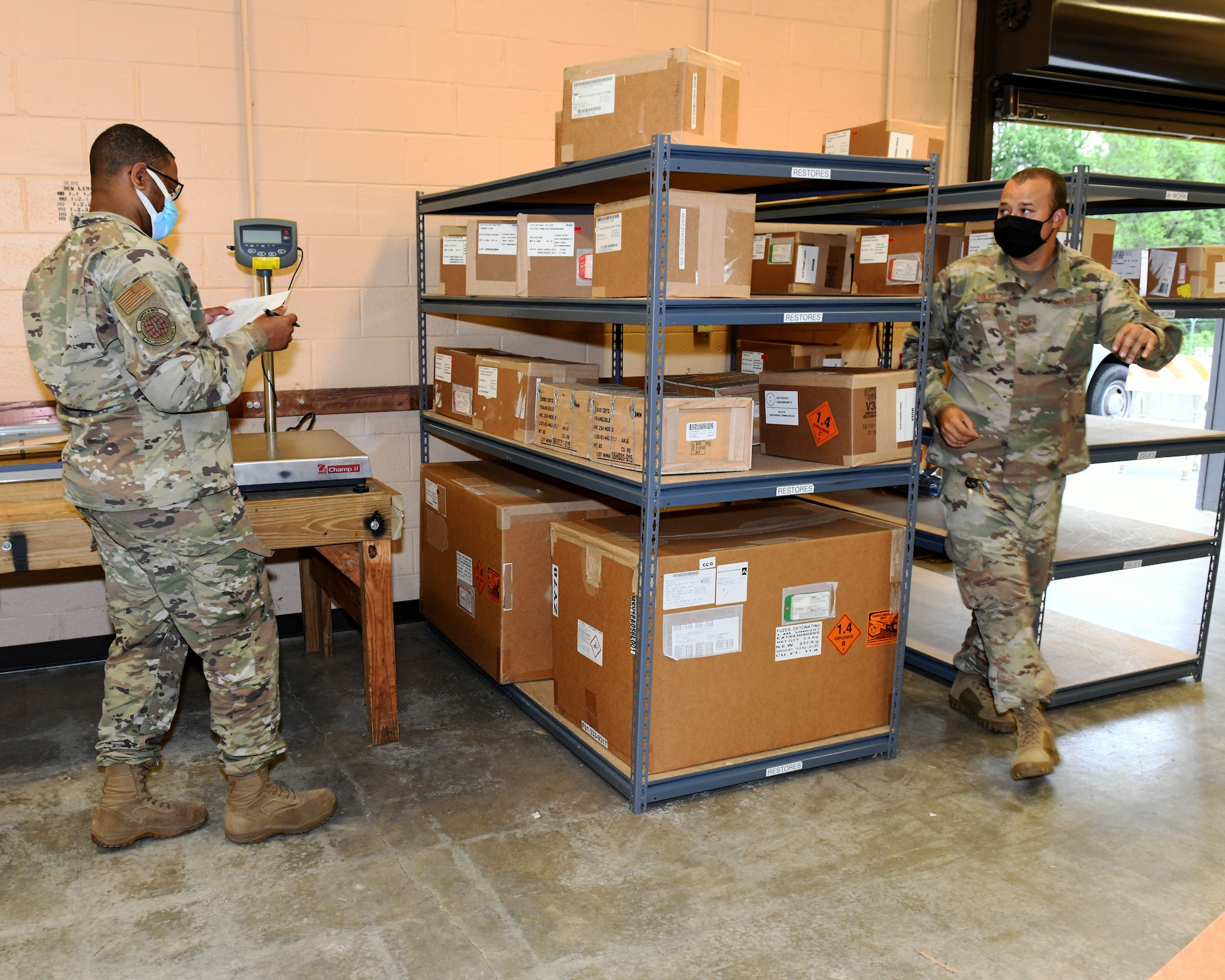 Men inspecting boxes